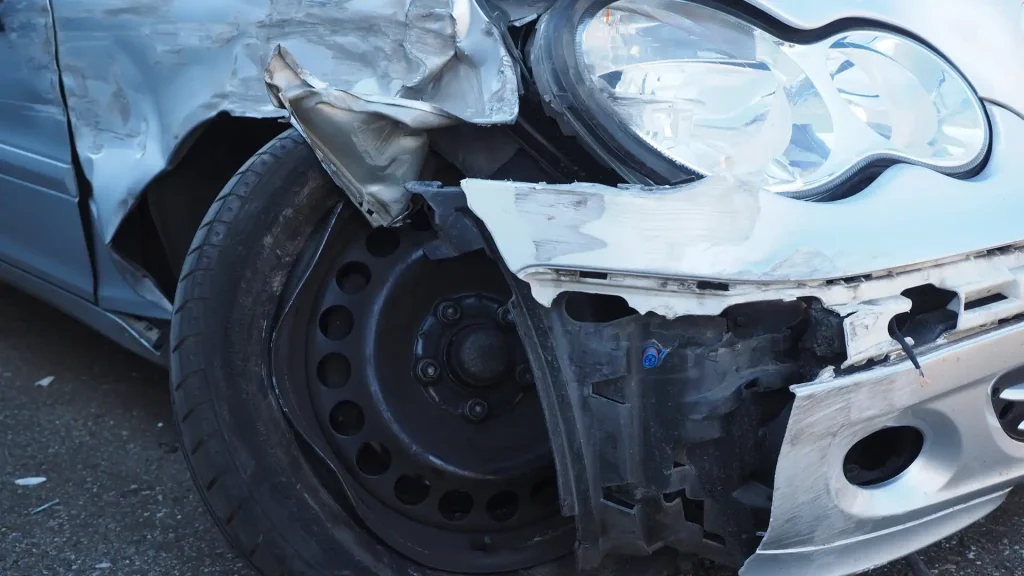 Damaged front wheel and crumpled fender